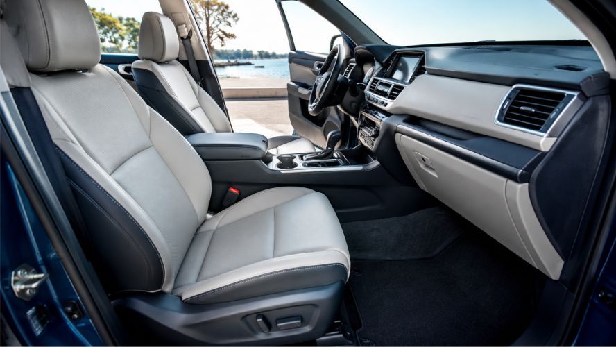 Clean vehicle interior with seats, dashboard and center console